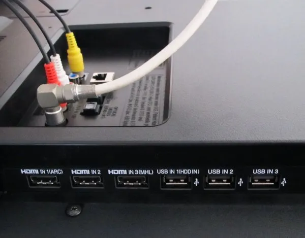 LG TV ports with cables connected.