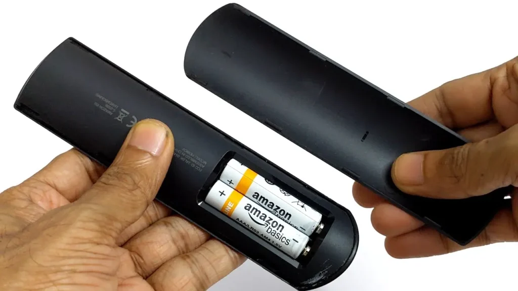 Inserting batteries into Firestick remote