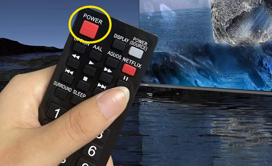 Sharp TV remote control showing the Power button.