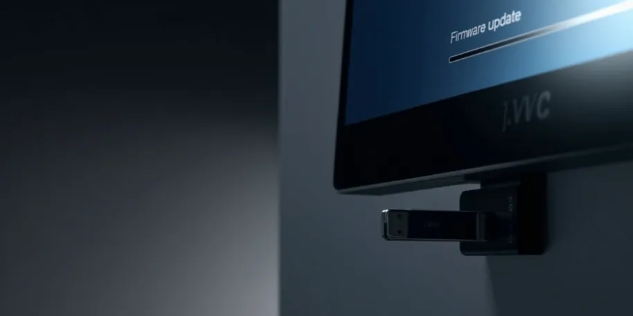 USB drive inserted into a JVC TV for firmware update.