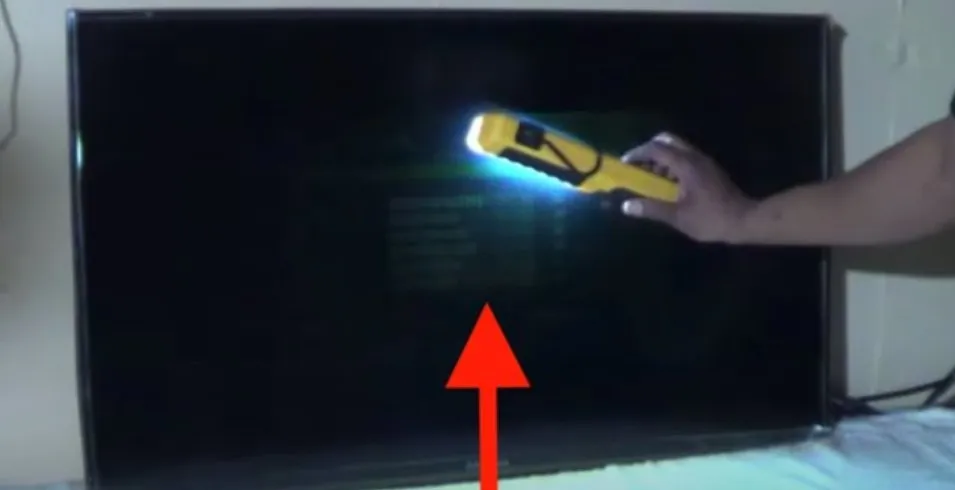 Checking TV backlight with flashlight