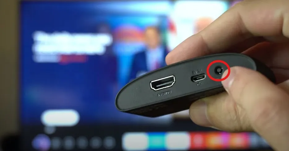 Close-up view of reset button on back of Roku device