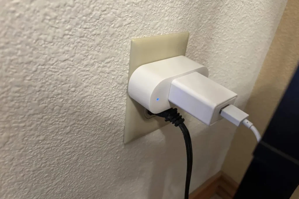 Smart plug plugged into a wall outlet.