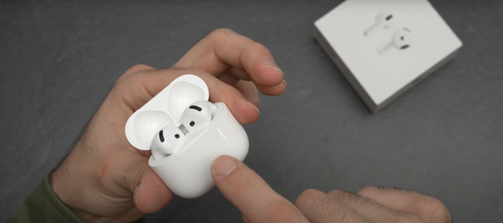 AirPods case with pairing button pressed